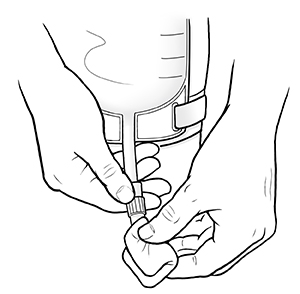 Closeup of hands cleaning tube of urinary catheter bag.